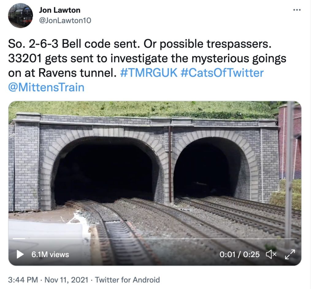 Screen shot of a tweet from Jon Lawson, with a video still of a train tunnel with two openings.