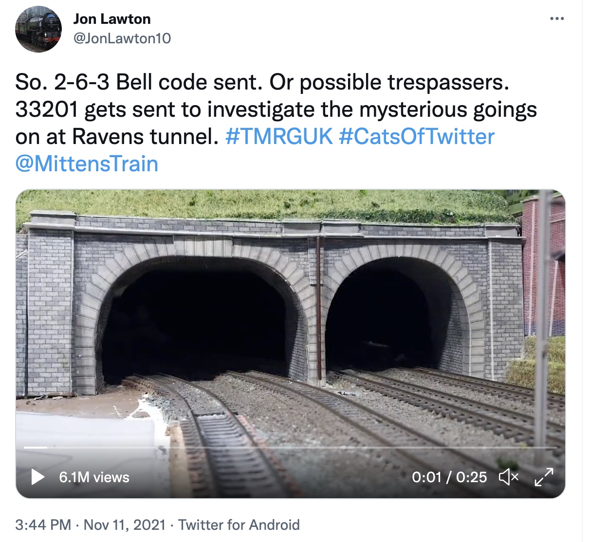 Screen shot of a tweet by Jon Lawson, showing a video still of a train tunnel with two openings.